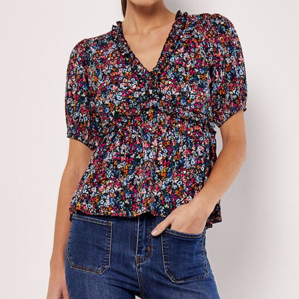 Top with ruffle detail and 1/2 sleeve